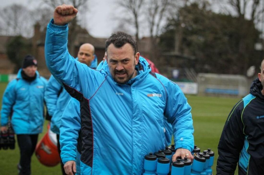 Danny Scopes celebrating in his Concord Rangers tracksuit