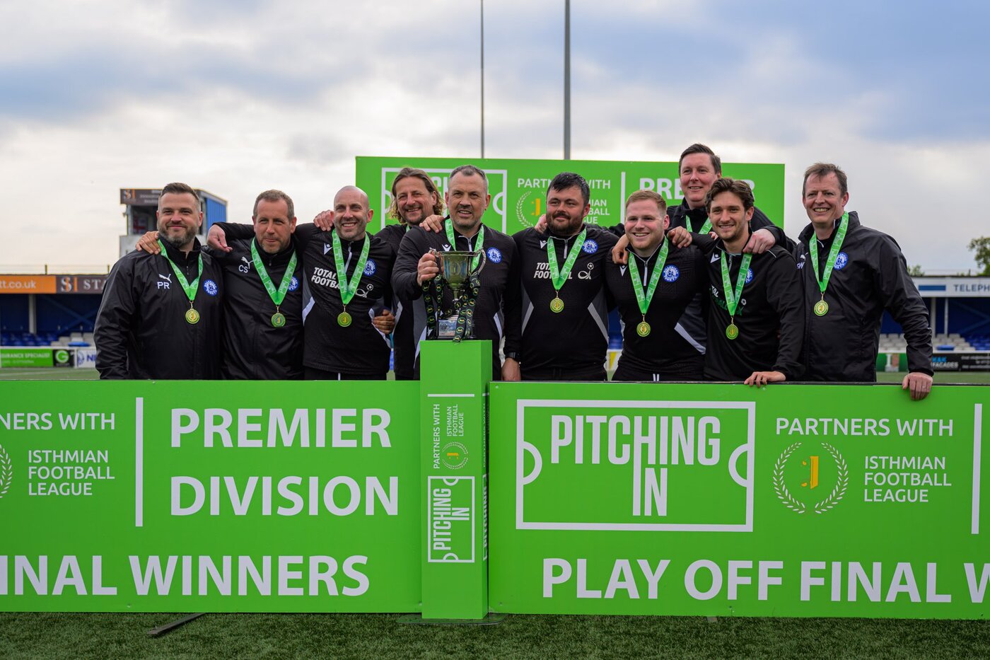 Danny Scopes and the Billericay Town backroom staff with the Pitching In Isthmian Premier Division Play-Off Final Winners trophy at New Lodge, 4 May 2026