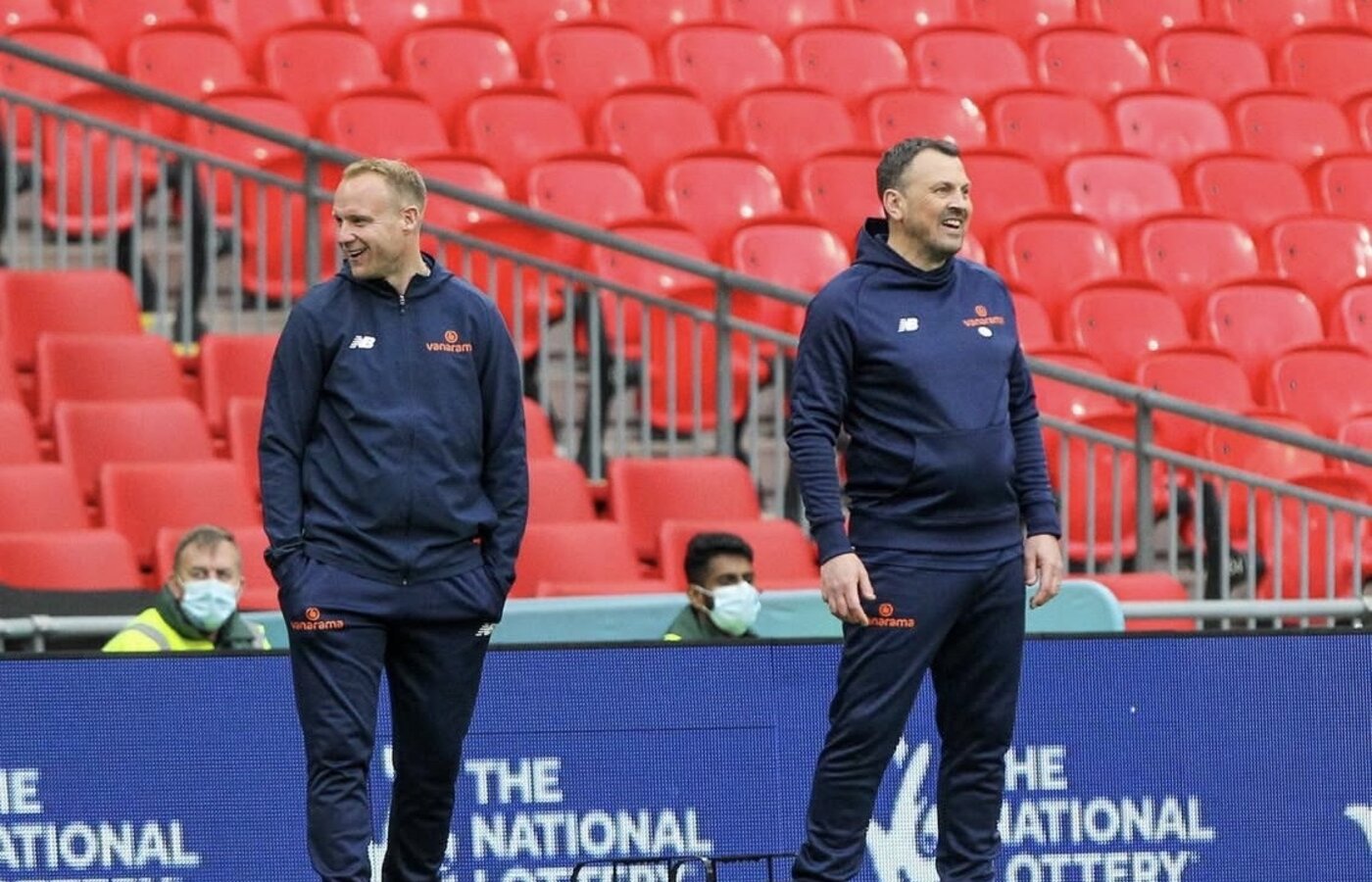 Danny Scopes and assistant manager Lee Minshull on the Wembley touchline before the FA Trophy final, behind closed doors