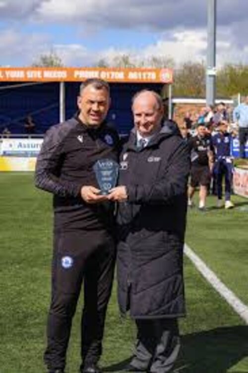 Danny Scopes receiving an award